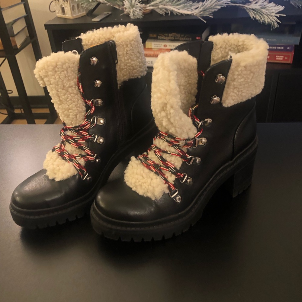 Black boots with fur and red,white and black laces.